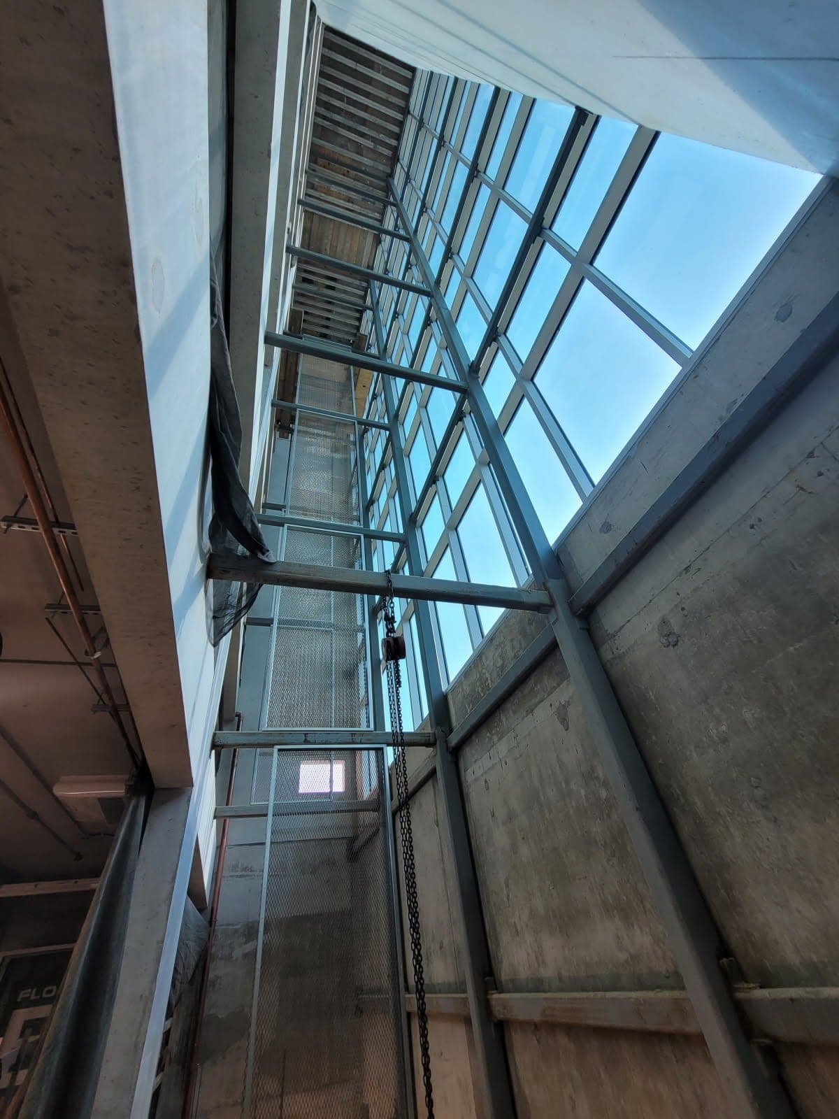 Structural steel framing viewed from below at the Paycom building