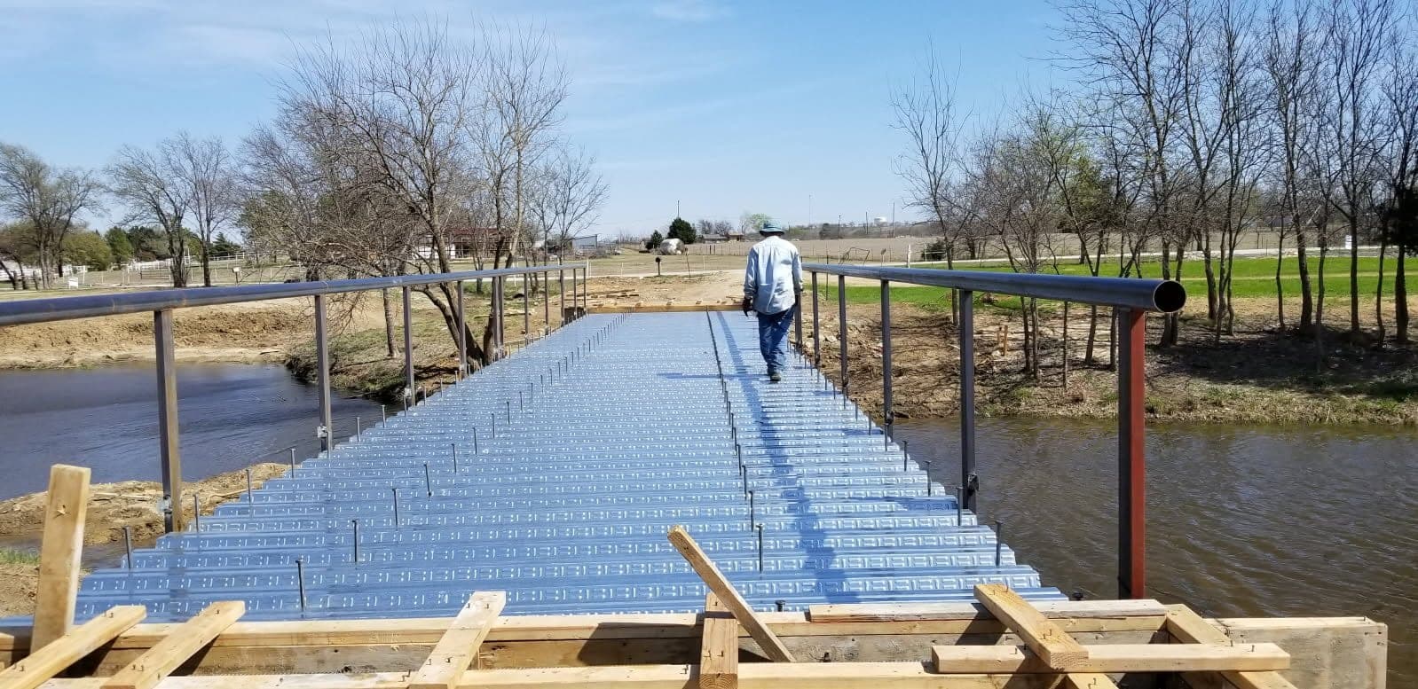 Custom steel driveway bridge fabrication and installation